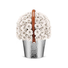 Decorative vase with white flowers and a brown handle on a white background