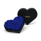 Heart-shaped box of royal blue roses with 'OnlyRoses' branding on a white background
