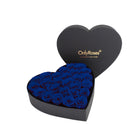 Heart-shaped box of blue roses with 'OnlyRoses' branding on a white background